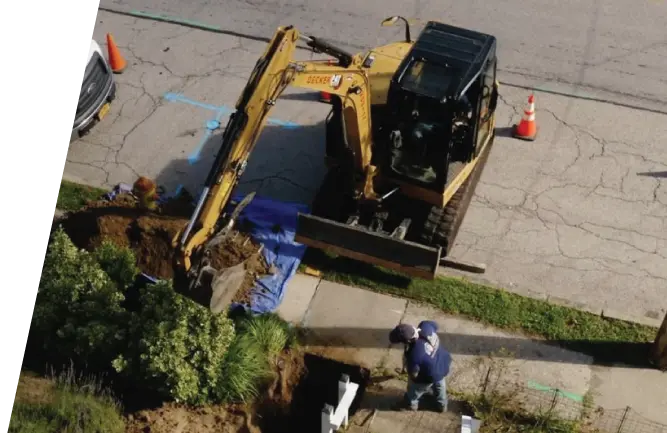 Drone view excavator digging in yard